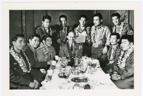 Servicepeople with leis gathered around table (ddr-densho-1007-264)