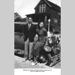 Well-dressed couple next to car (ddr-ajah-6-101)
