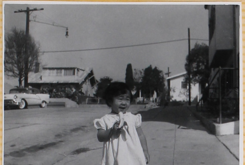 Susan Shiomi eating a banana (ddr-densho-522-308)