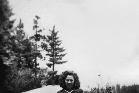 Amy Nagata sitting on a boulder (ddr-densho-336-17)