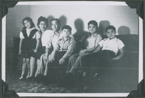 A family sitting on a couch (ddr-densho-201-761)