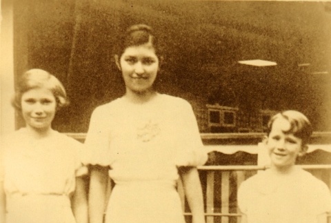 Young woman posing with a girl and boy (ddr-njpa-4-2467)