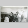 Photograph of women around a car in front of the Sierra Nevada (ddr-csujad-47-281)