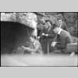 Two women and three men standing by large outside fireplace (ddr-densho-426-1965)