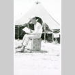 Soldier reading on stump (ddr-densho-1007-758)