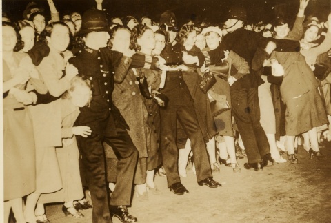 Police holding a crowd of fans back (ddr-njpa-1-2051)