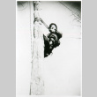Man climbing pole (ddr-densho-1007-859)
