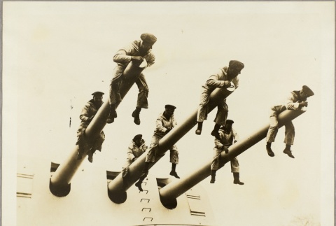 German sailors sitting on the Konigsberg's cannons (ddr-njpa-13-957)
