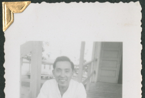 Man sitting on steps (ddr-densho-434-161)