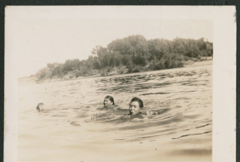 3 people swimming in water (ddr-densho-378-659)