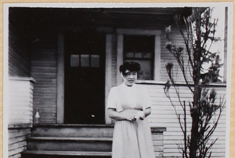Young woman by porch (ddr-densho-522-6)