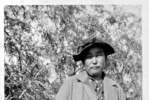 Figure outside in coat and hat (ddr-densho-1007-57)