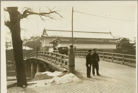 Two police officers standing guard at a bridge (ddr-njpa-13-1237)