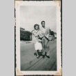 Couple poses together in street (ddr-densho-321-256)
