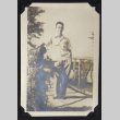 Man standing on a Rohwer bridge (ddr-densho-542-599)