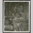 Photo of a man with two children (ddr-densho-483-750)