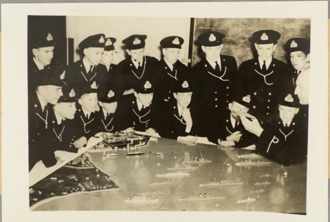 Boys in a youth auxiliary unit looking at model battleships (ddr-njpa-13-615)