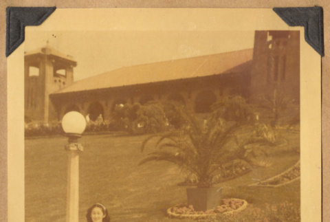 Grace poses by a building (ddr-densho-542-134)
