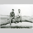 Two soldiers on a log (ddr-densho-1007-728)