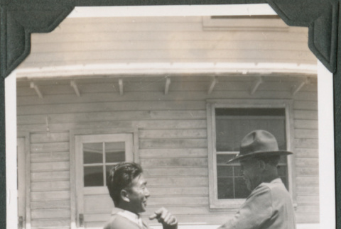 Two men standing outside building, Joe Iwataki on left (ddr-ajah-2-124)