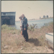 Agnes and Chester Sakura standing on shore by ship (ddr-densho-523-453)