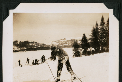 Walter Matsuoka skis down a snowy hill (ddr-densho-390-101)