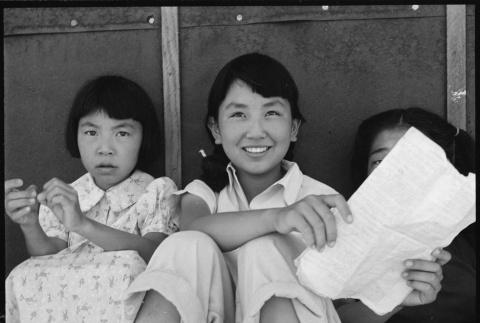 Young Japanese Americans sitting in shade (ddr-densho-151-405)
