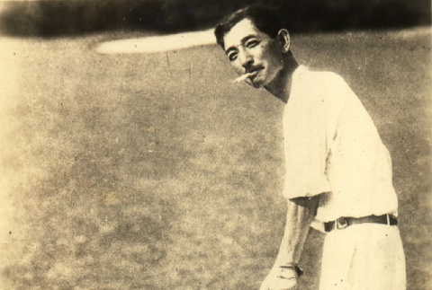 Hiroshi Saito posing with a golf club (ddr-njpa-4-2514)