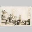 A family in front of a fence (ddr-densho-321-667)