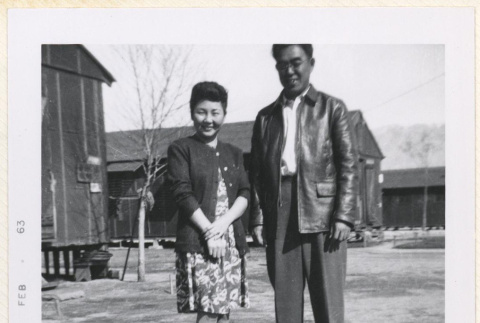 Couple standing in front of barracks (ddr-manz-10-114)