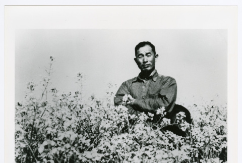 Portrait of a man with flowers (ddr-densho-1007-373)