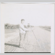 Man setting up tripod (ddr-densho-377-1646)
