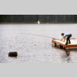 Stuart Wong trying to retrieve a bag in the water (ddr-densho-336-875)