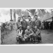 Seven men in fatigues by tents (ddr-densho-563-18)