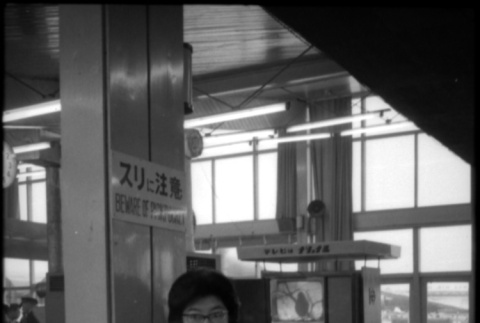 Tomoye (Nozawa) Takahashi in waiting room of station (ddr-densho-426-2345)