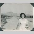 Woman walking in Heart Mountain concentration camp (ddr-densho-321-116)