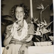 A woman wearing leis (ddr-njpa-1-982)