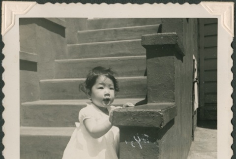 A girl on front steps (ddr-densho-321-1015)