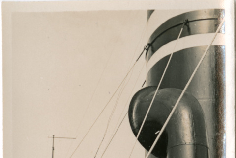 Man standing by ship's funnels (ddr-densho-426-1554)