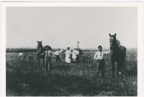 Group outside with two horses (ddr-densho-1007-15)