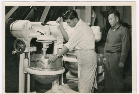 Man using industrial mixer (ddr-densho-499-48)