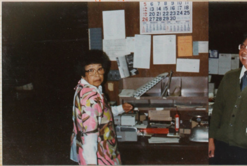 Man and woman standing by desk (ddr-densho-426-1346)
