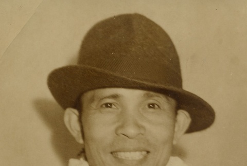 Hilario Moncado wearing leis (ddr-njpa-2-724)