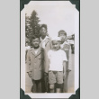 Photo of a man with three children (ddr-densho-483-1213)
