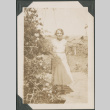 Woman by flowers (ddr-densho-316-244)