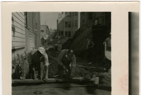 Men working on sidewalk (ddr-densho-426-1429)