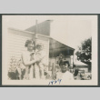woman holding baby next a young child (ddr-densho-378-730)