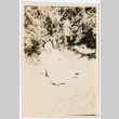 Woman sitting in the grass (ddr-densho-433-809)