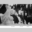 Lydia Nagata, Grace Koda, and Mollie Abe sitting on a boulder (ddr-densho-336-55)