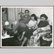 Two women and a man sitting on sofa (ddr-densho-293-180)